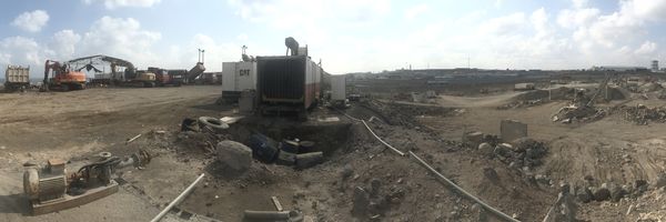 Field engineering team commissioning a mobile crushing plant on a remote African construction site