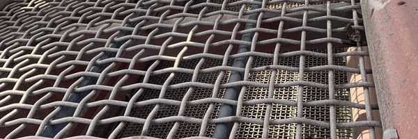 Close-up of worn jaw crusher liner showing wear pattern analysis markers
